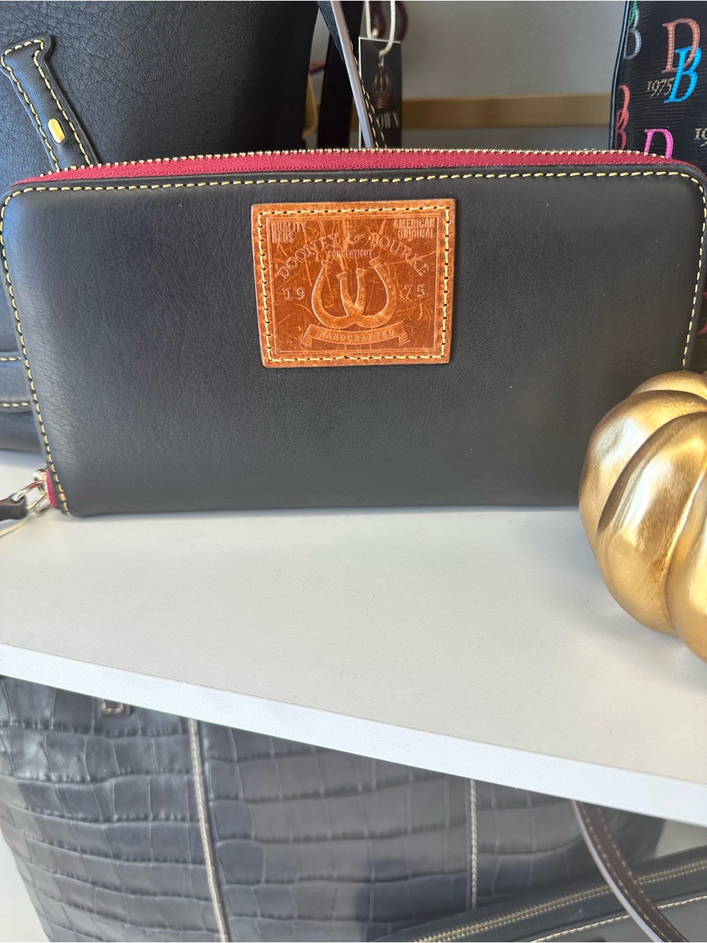 Dooney & Bourke Black Leather Zip Wallet with Brown Patch